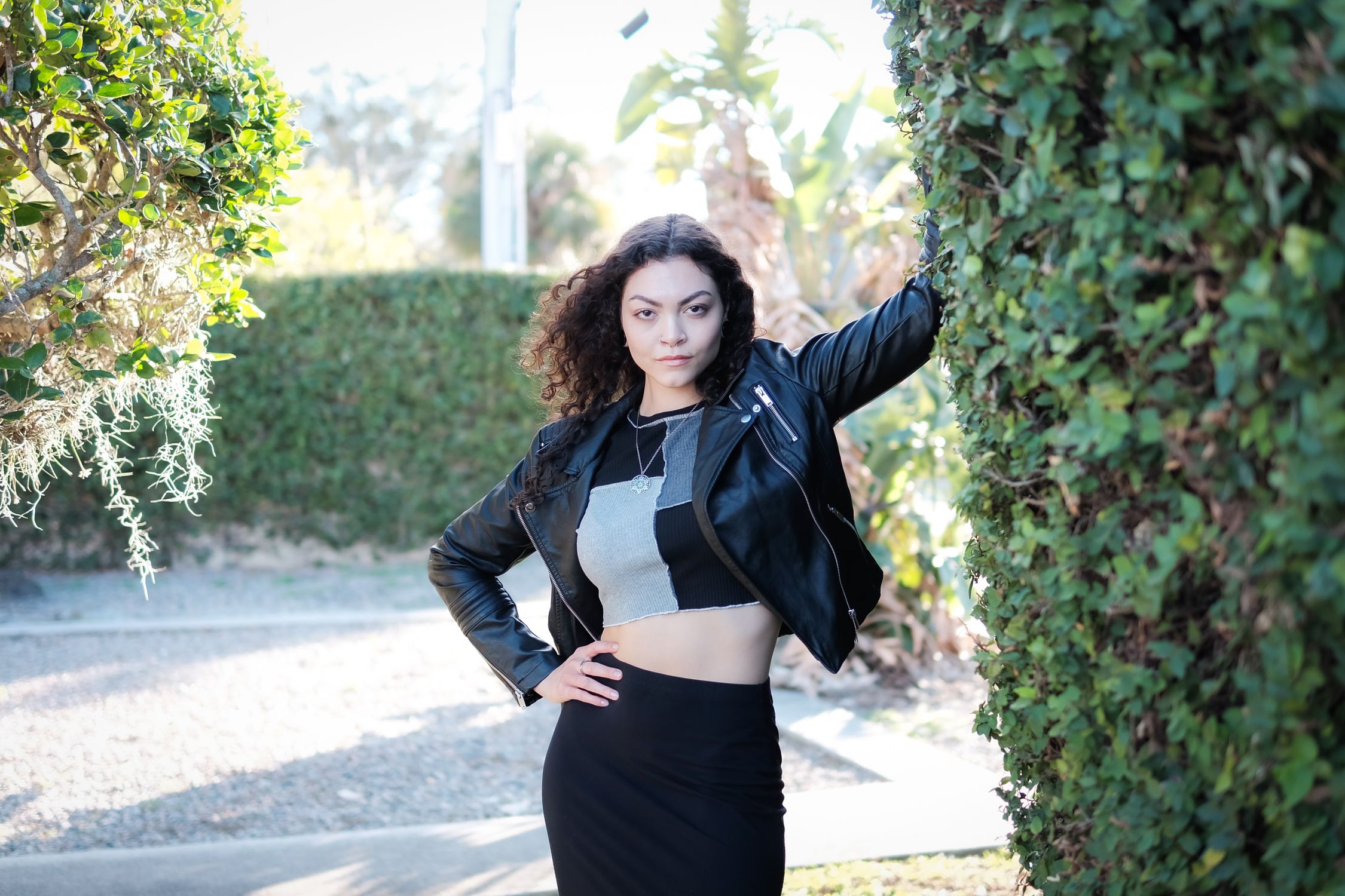 Stylish Woman Posing Outdoors in Leather Jacket · Free Stock Photo