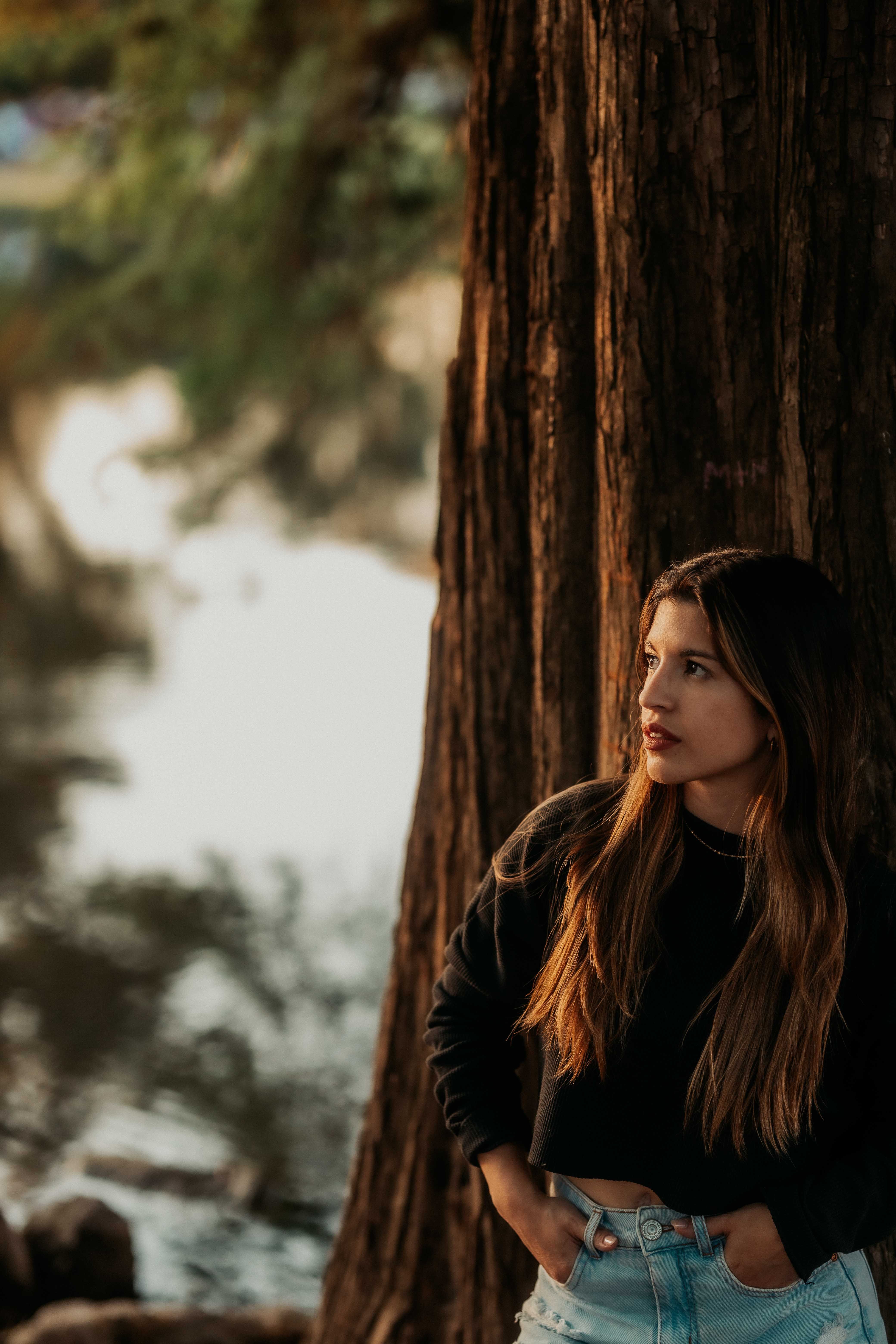 Contemplative Woman by a Tranquil Lake · Free Stock Photo
