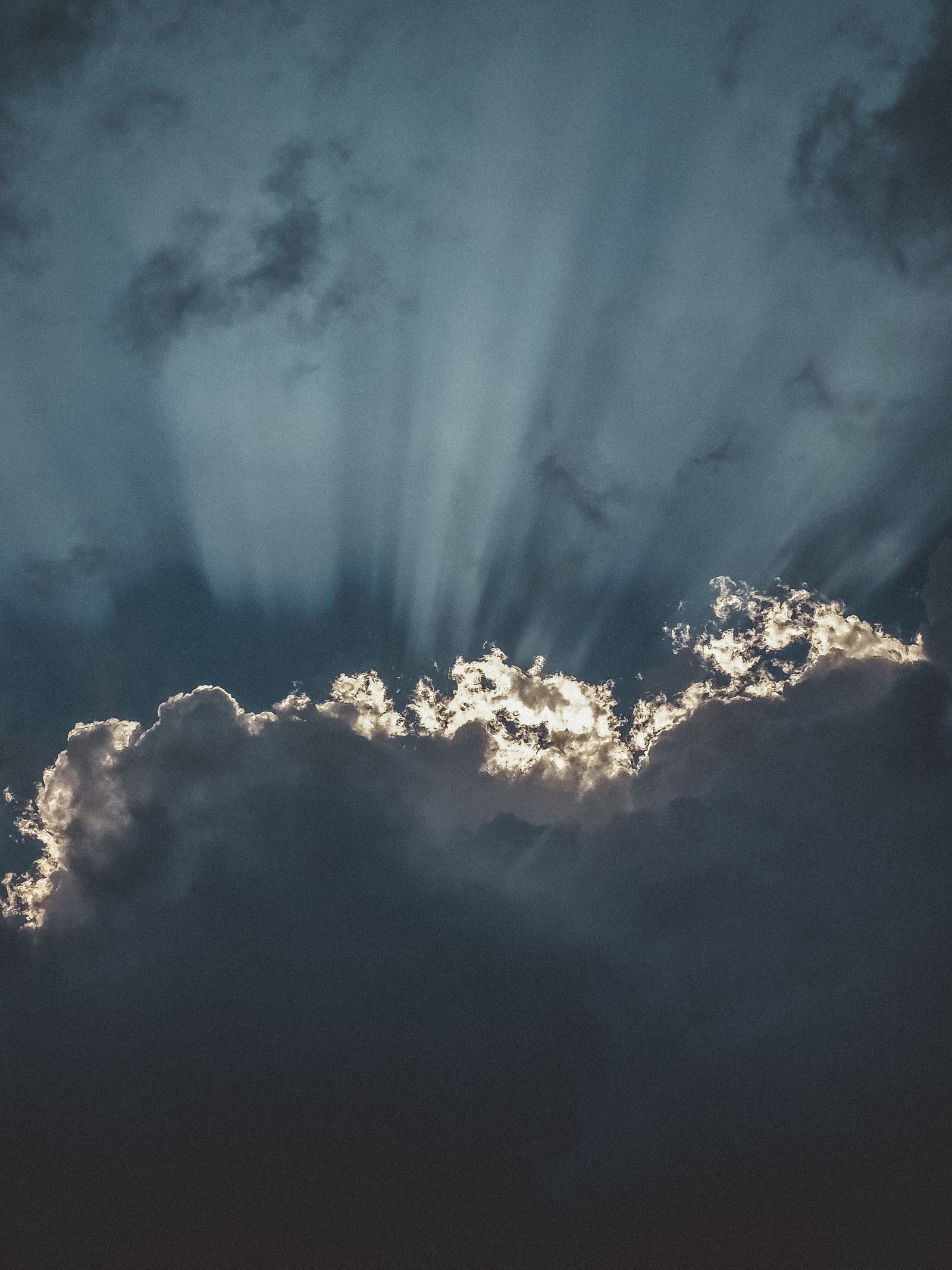 Dramatic Sun Rays Breaking Through Storm Clouds · Free Stock Photo