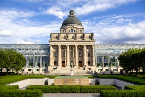 Free The stunning Bavarian State Chancellery in Munich, showcasing neoclassical architecture and surrounding gardens. Stock Photo