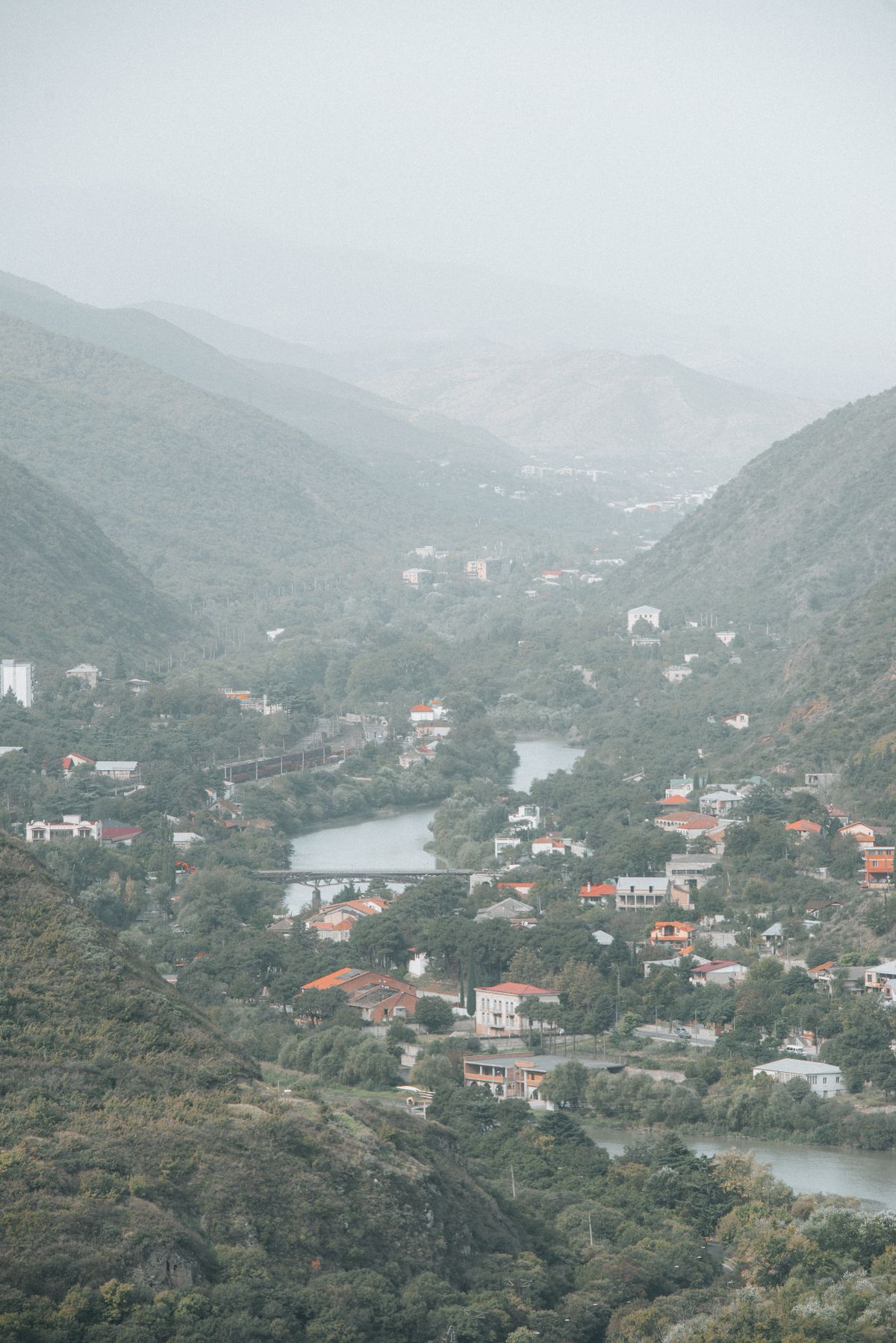 Stunning aerial view of Tbilisi lush mountain valley and river, Georgia