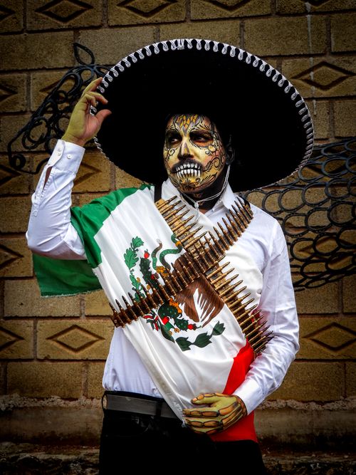 Free Colorful Day of the Dead costume with Mexican flag and charro hat captured in Mexico City. Stock Photo