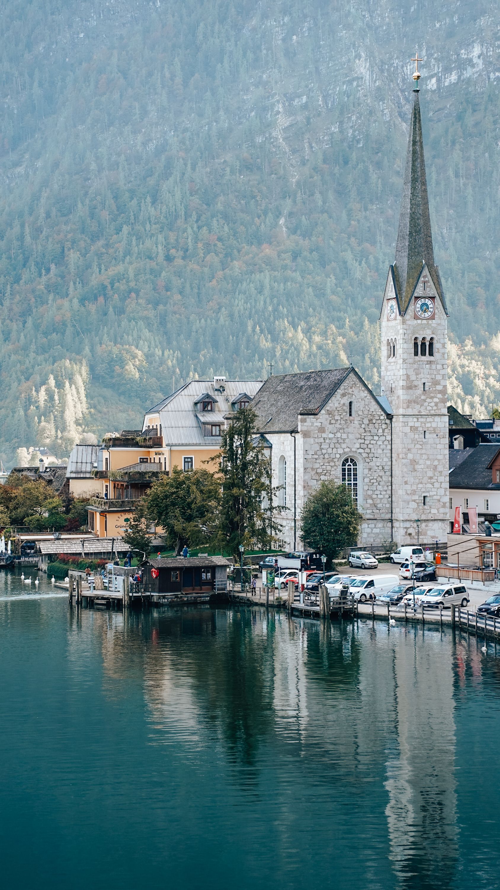 Picturesque Church by Mountain Lake in Hallstatt · Free Stock Photo