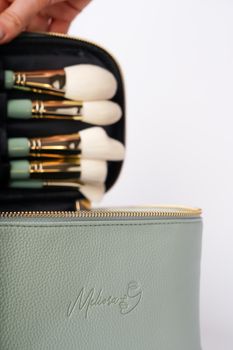 Discover an elegant makeup brush set in a stylish textured case, perfect for beauty essentials.
