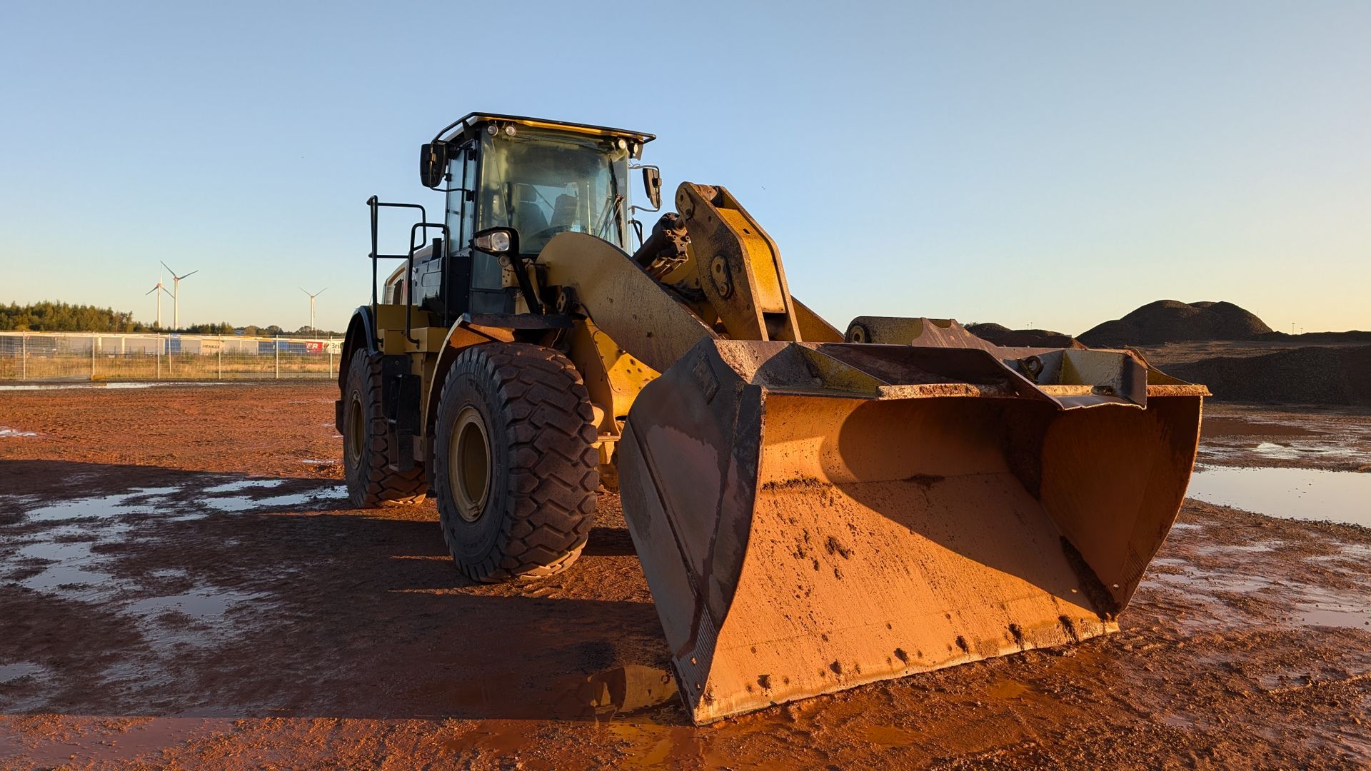 Heavy Machinery at Construction Site During Sunset