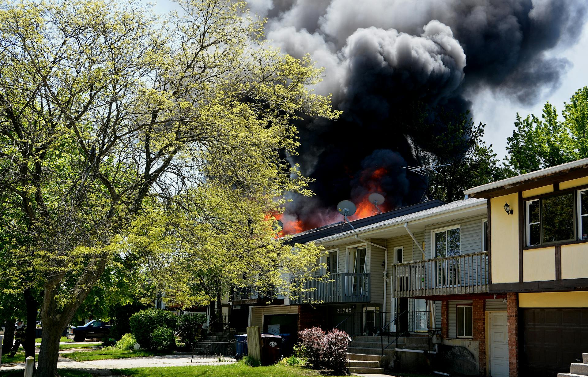 House Fire with Smoke in Suburban Neighborhood