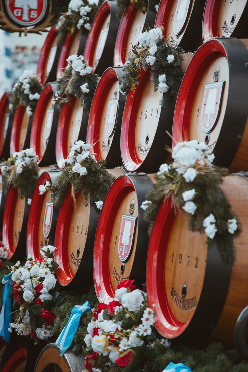 Colorful barrels decorated for Oktoberfest in Munich with festive garlands