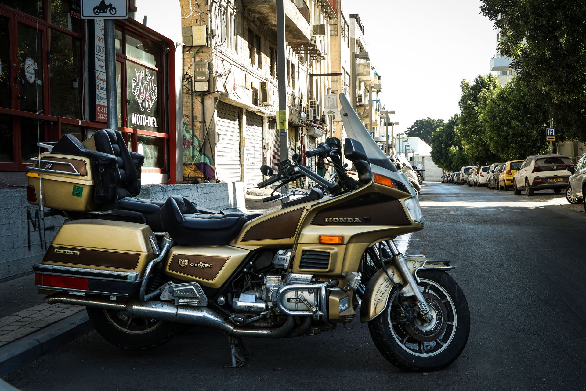 Vintage Honda Motorcycle Parked on Urban Street