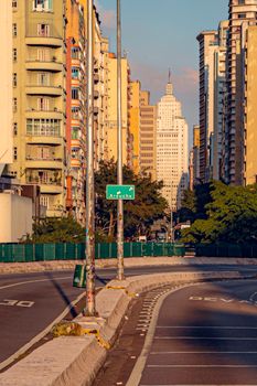 Urban street scene with skyscrapers during sunset in São Paulo, Brazil.