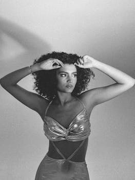 Elegant black and white portrait of a woman in a fashionable dress.