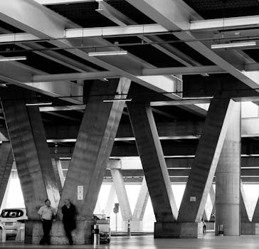 Black and white structural columns of an airport in São Paulo, capturing modern architecture.
