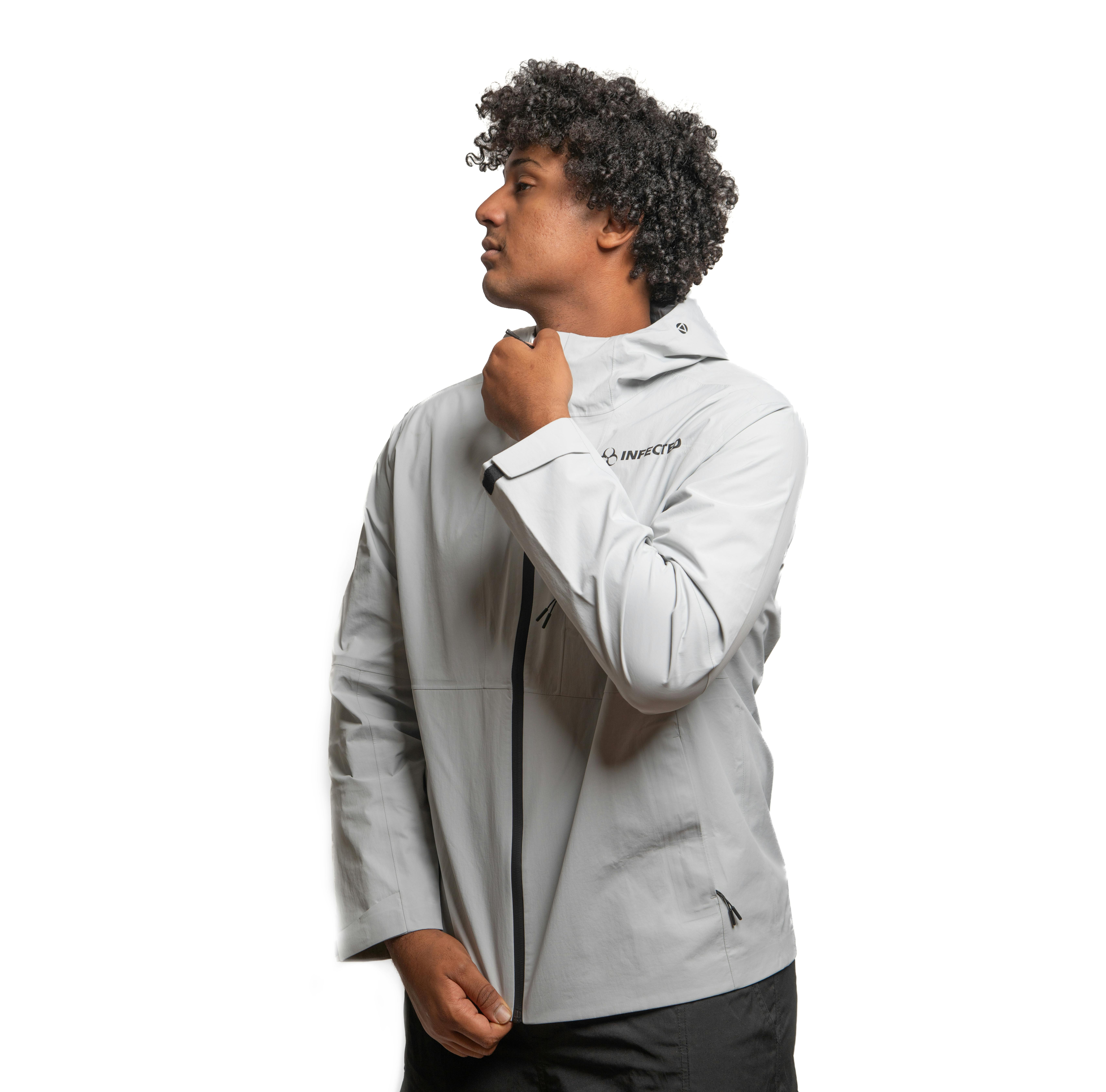 Man wearing modern grey winter sports jacket showcasing warmth without bulk messaging