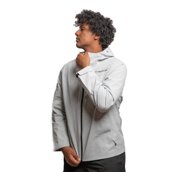 Portrait of a man wearing a modern grey winter sports jacket. Perfect for outdoor activities.