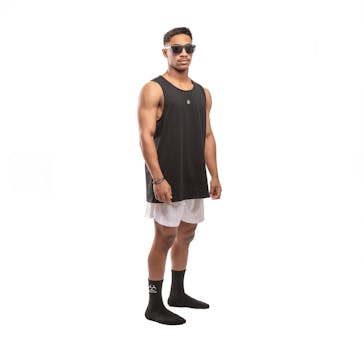 A young man in casual sportwear posing against a white background.