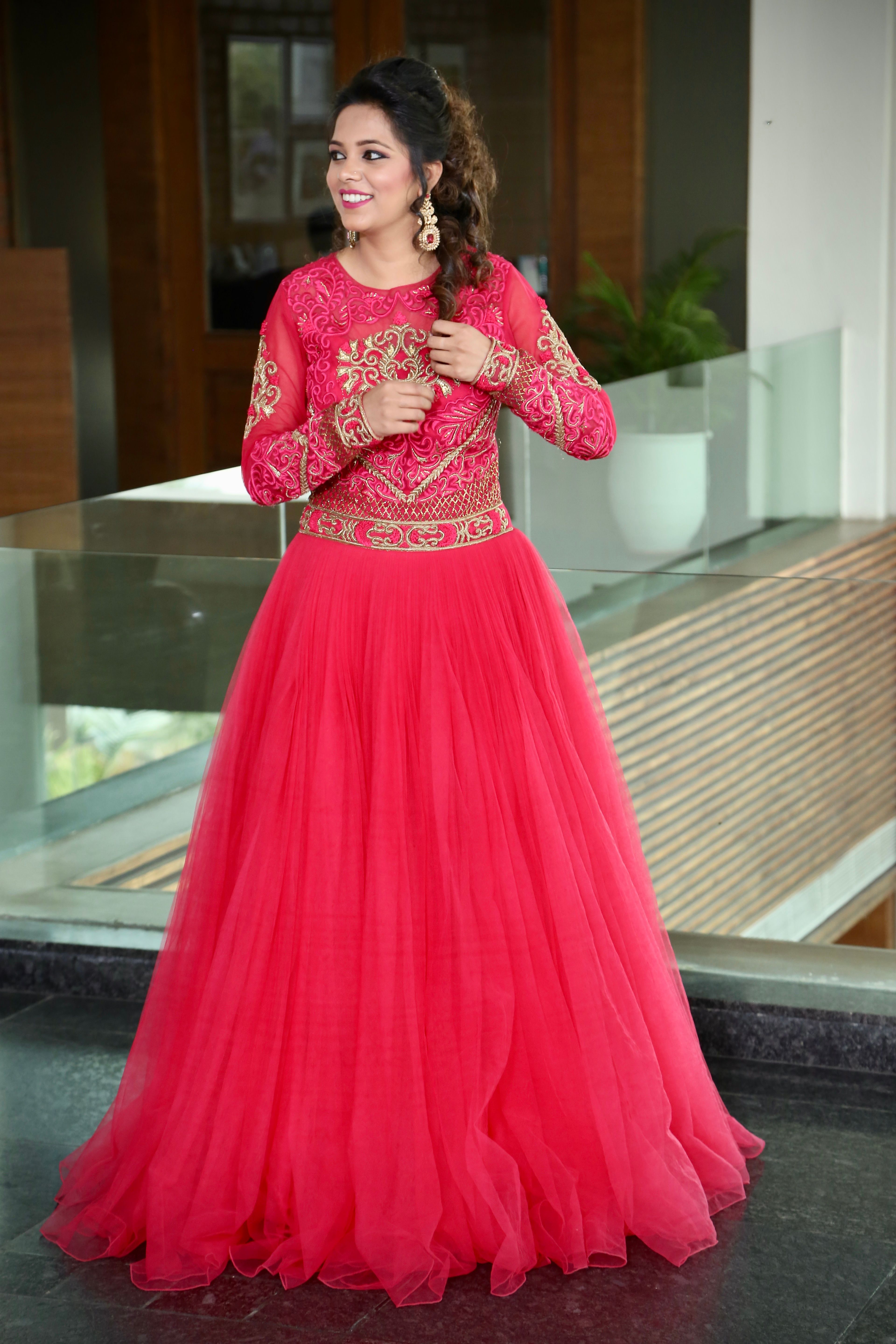 Elegant Woman in Vibrant Red Traditional Dress Indoors · Free Stock Photo