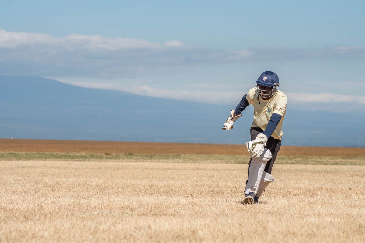 A fielder in position during a cricket match