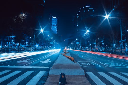 Dynamic long exposure capturing the vibrant night life on Mexico City's Paseo de la Reforma.