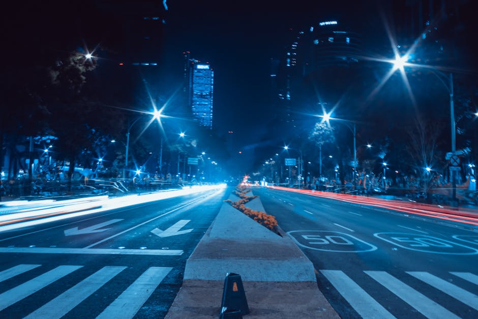 Dynamic long exposure capturing the vibrant night life on Mexico City's Paseo de la Reforma.