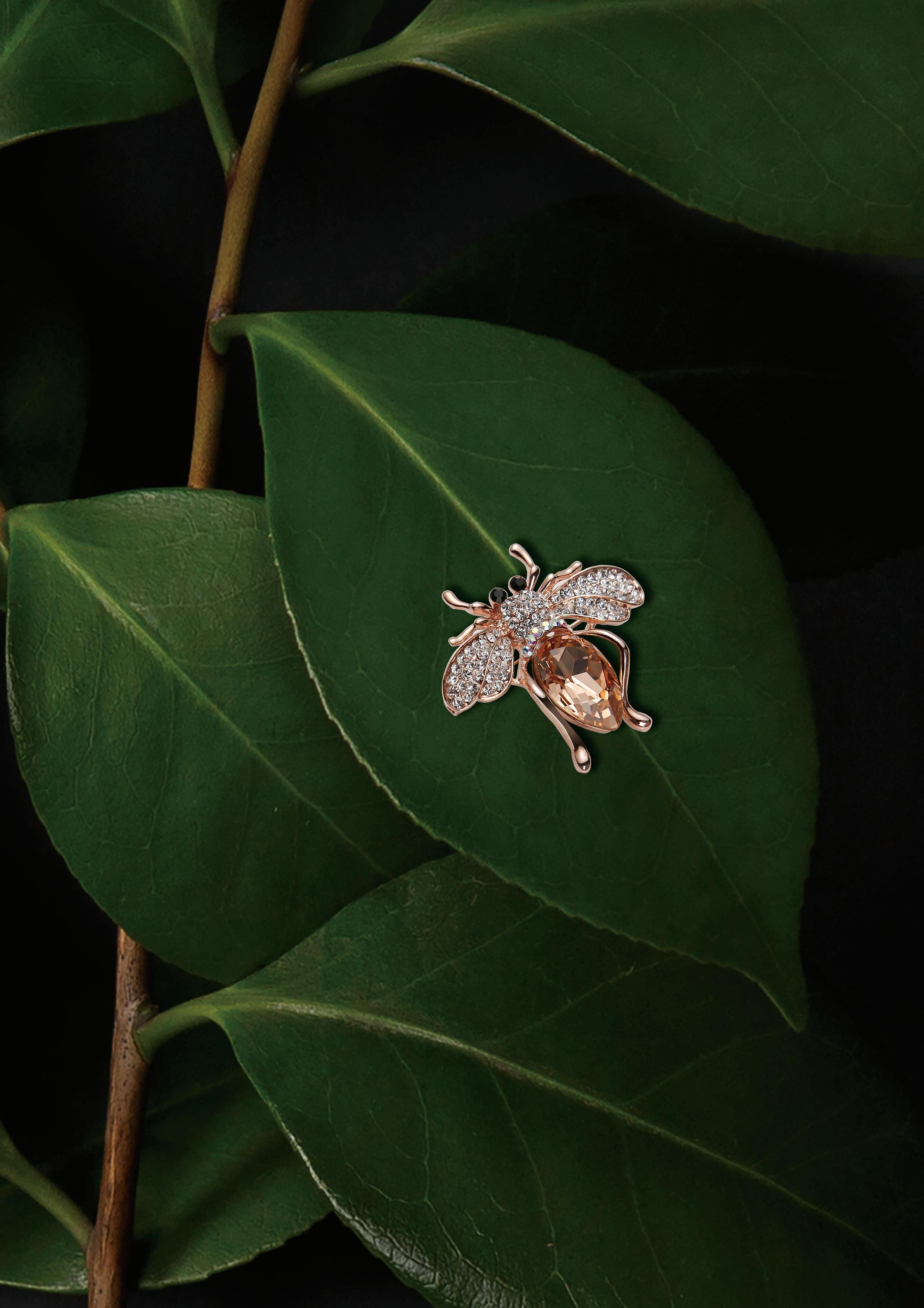 rose gold colored insect pendant