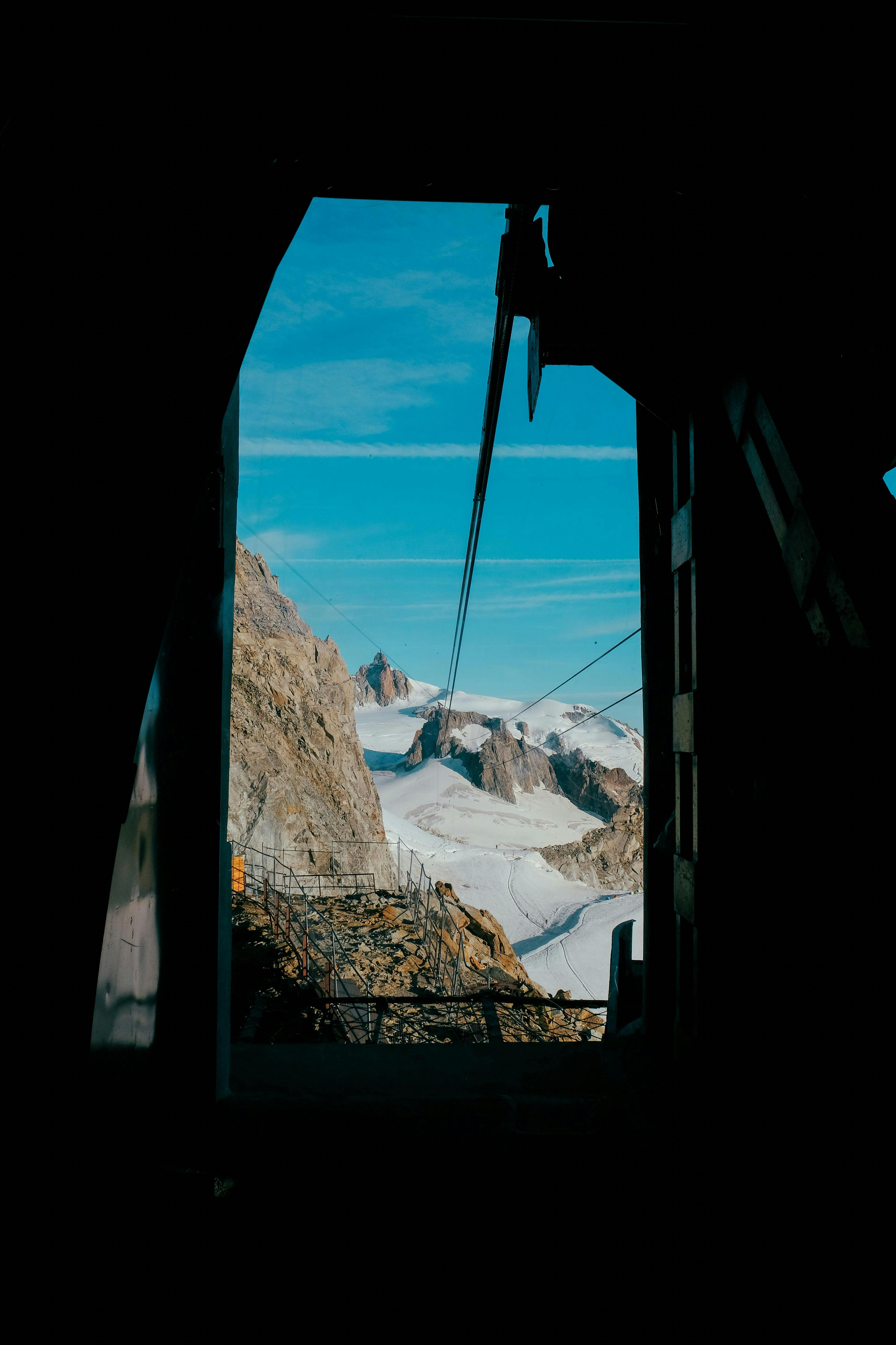 Prescription Goggle Inserts - Scenic view of snowy mountains and glaciers from a cable car in the French Alps.