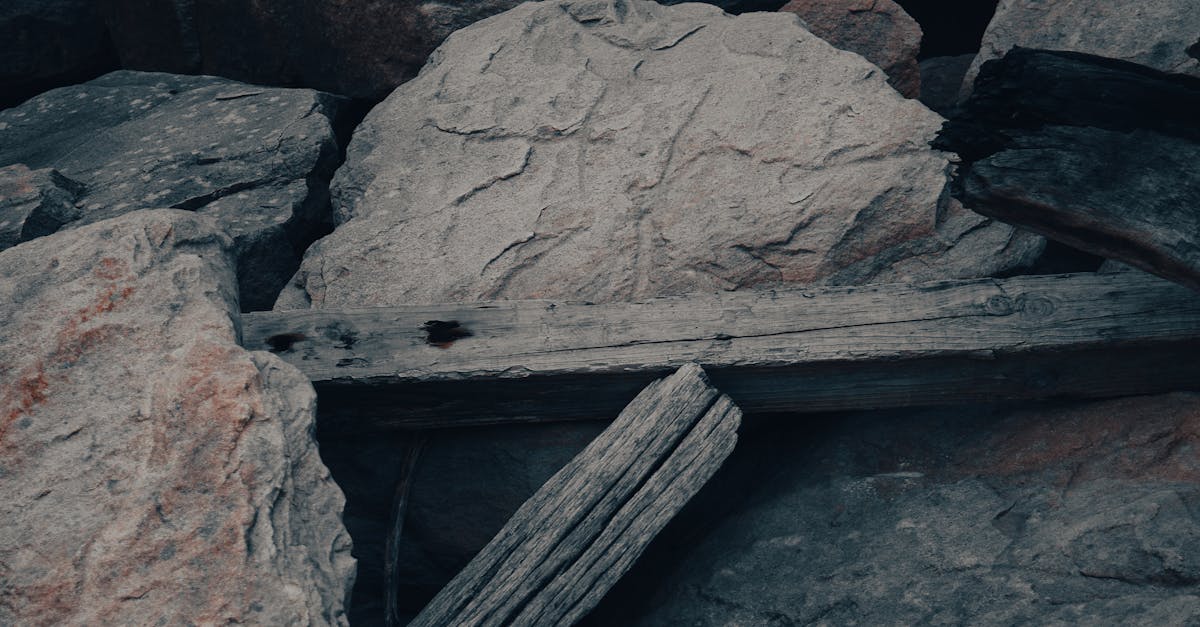 Stones and Wooden Plank Composition Outdoors · Free Stock Photo