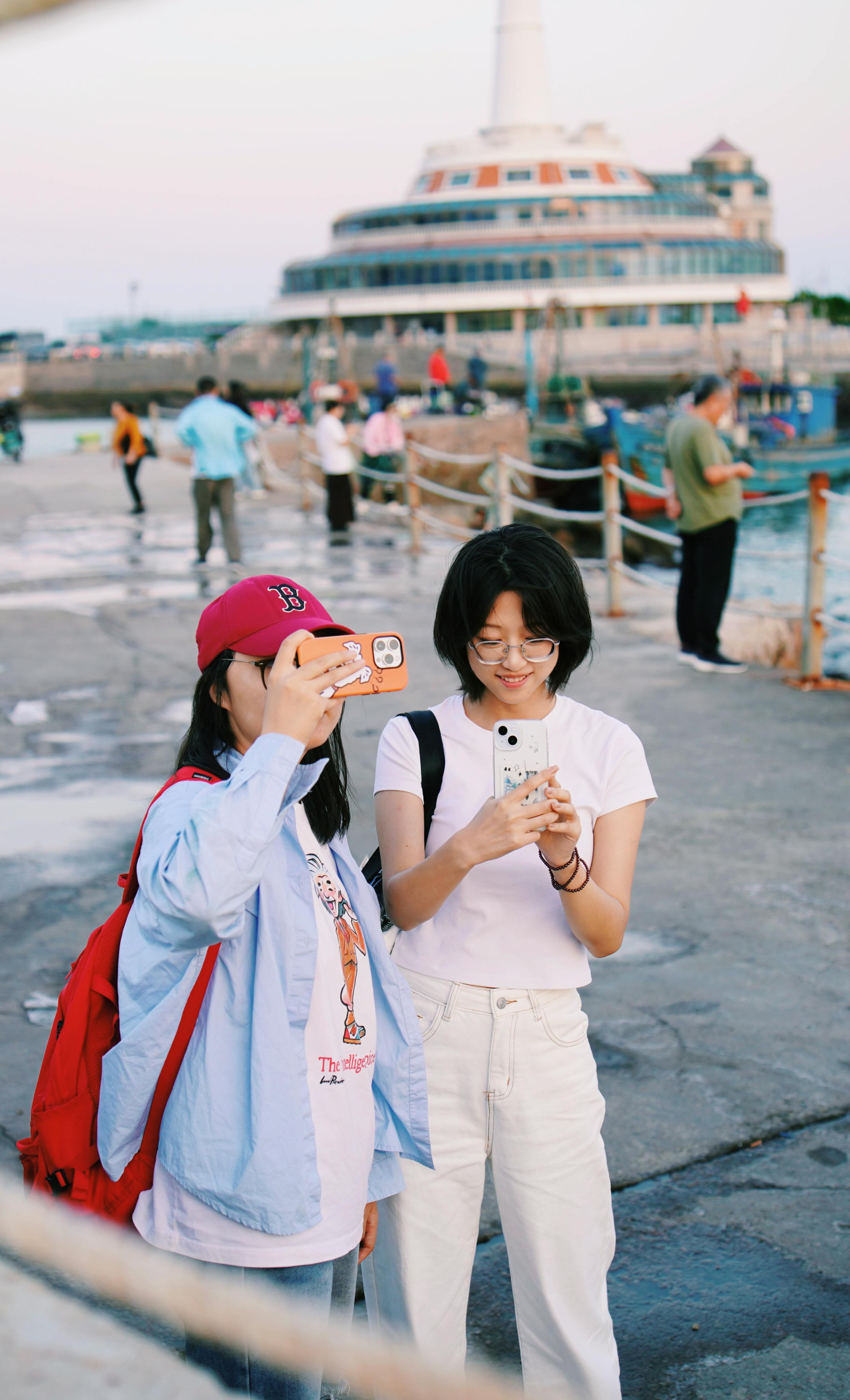 tourists capturing memories by waterfront