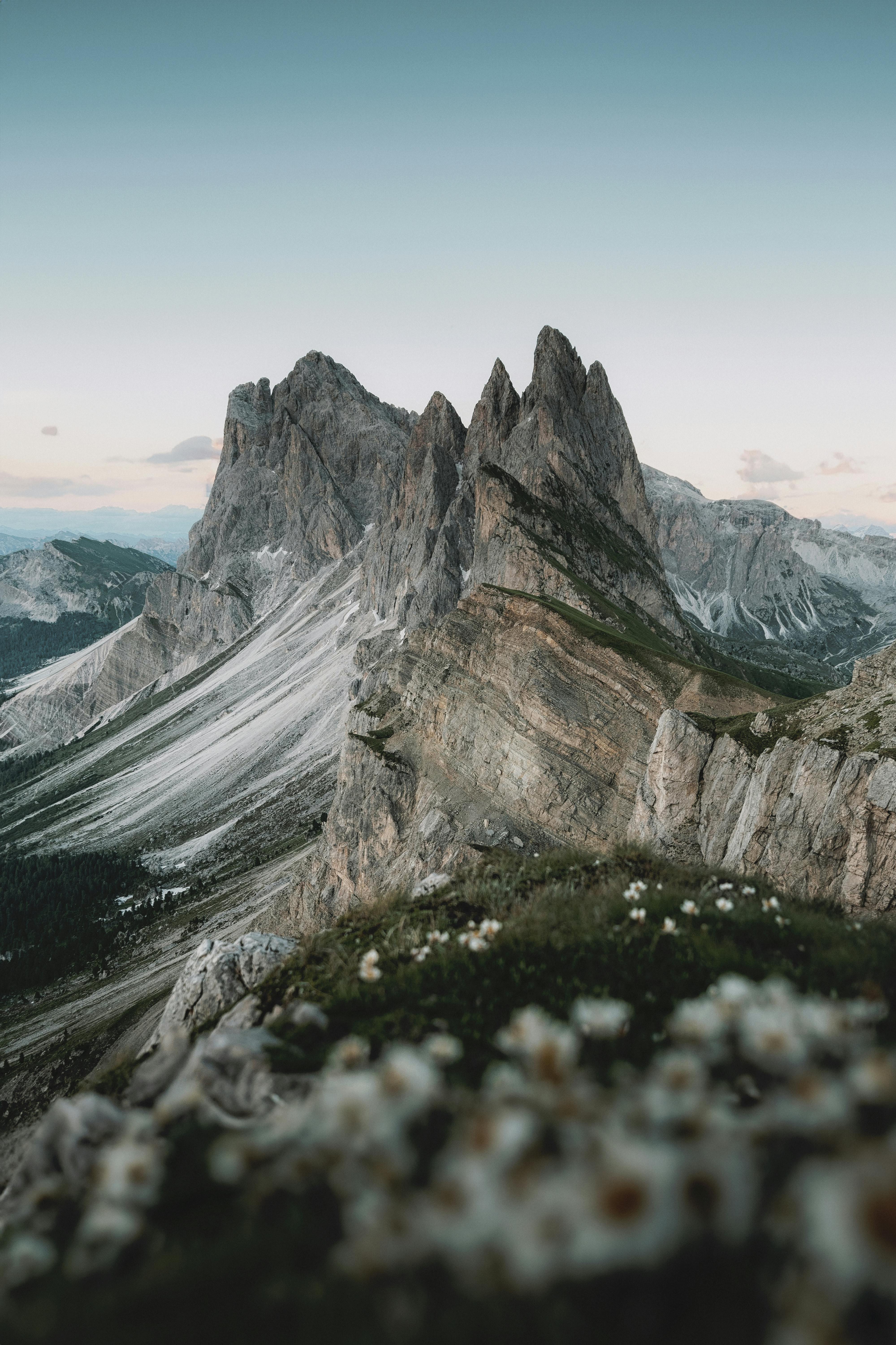Breathtaking view of rocky mountain peaks and alpine meadow in the Italian Alps.
