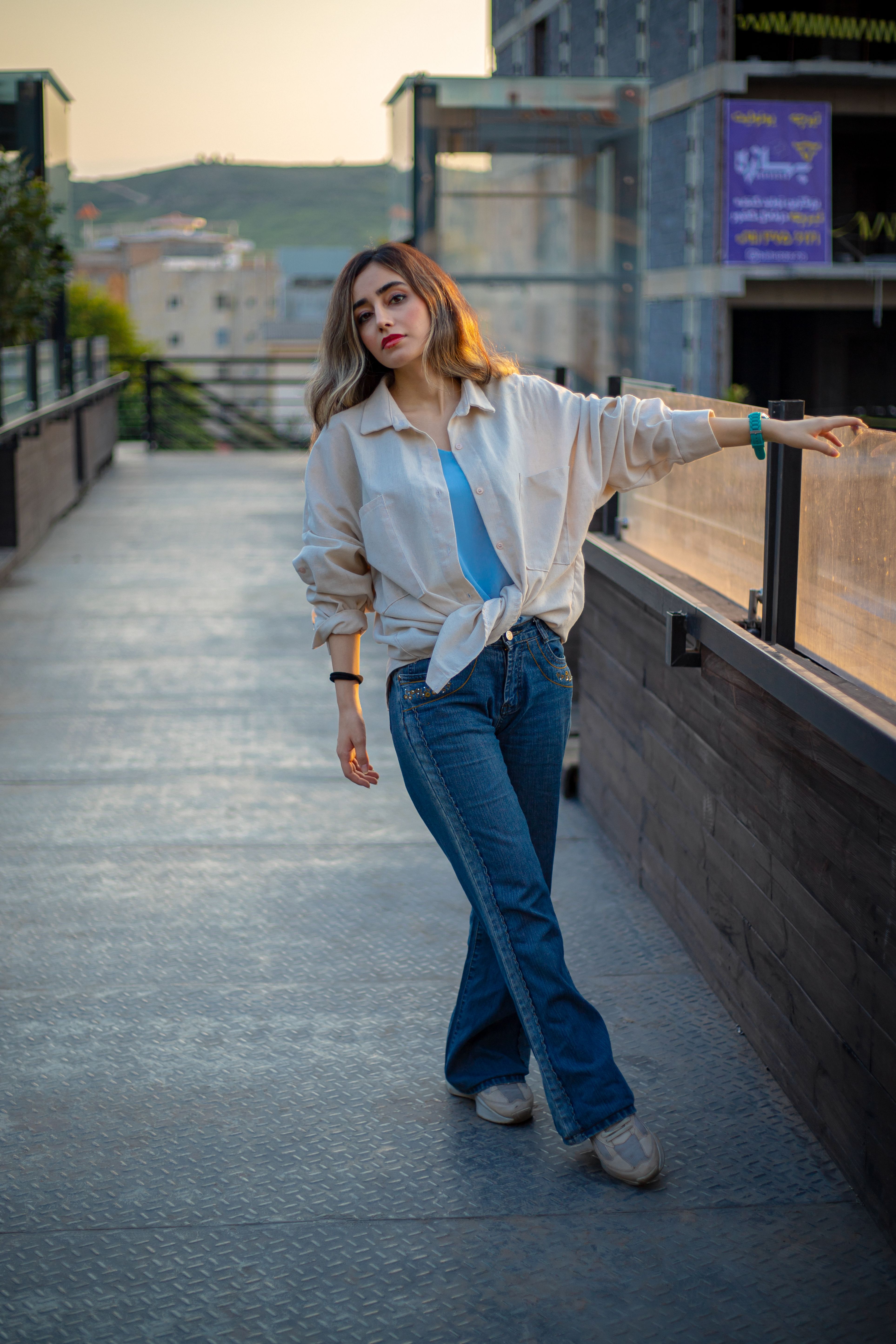Woman in a basic bodysuit with a flowy midi skirt
