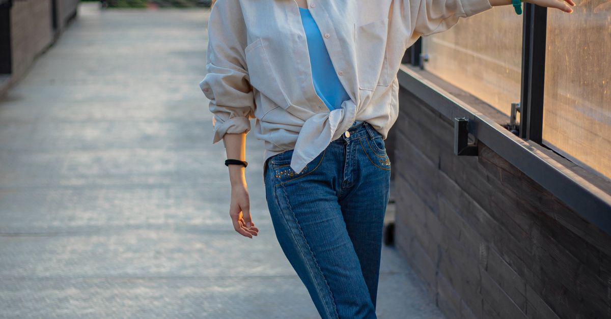 Woman in a basic bodysuit with a flowy midi skirt