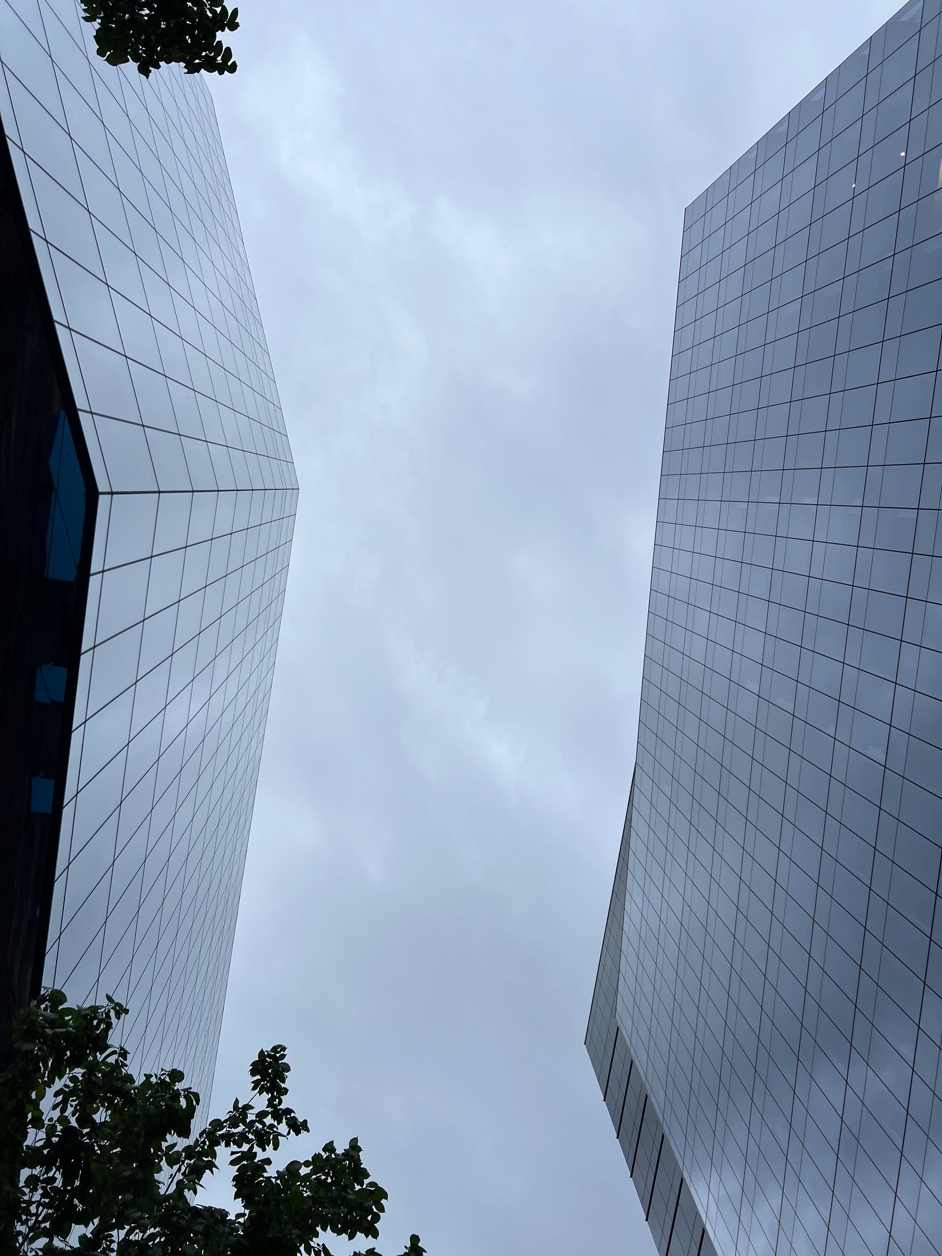 Modern Architecture Skyscrapers Against Cloudy Sky · Free Stock Photo