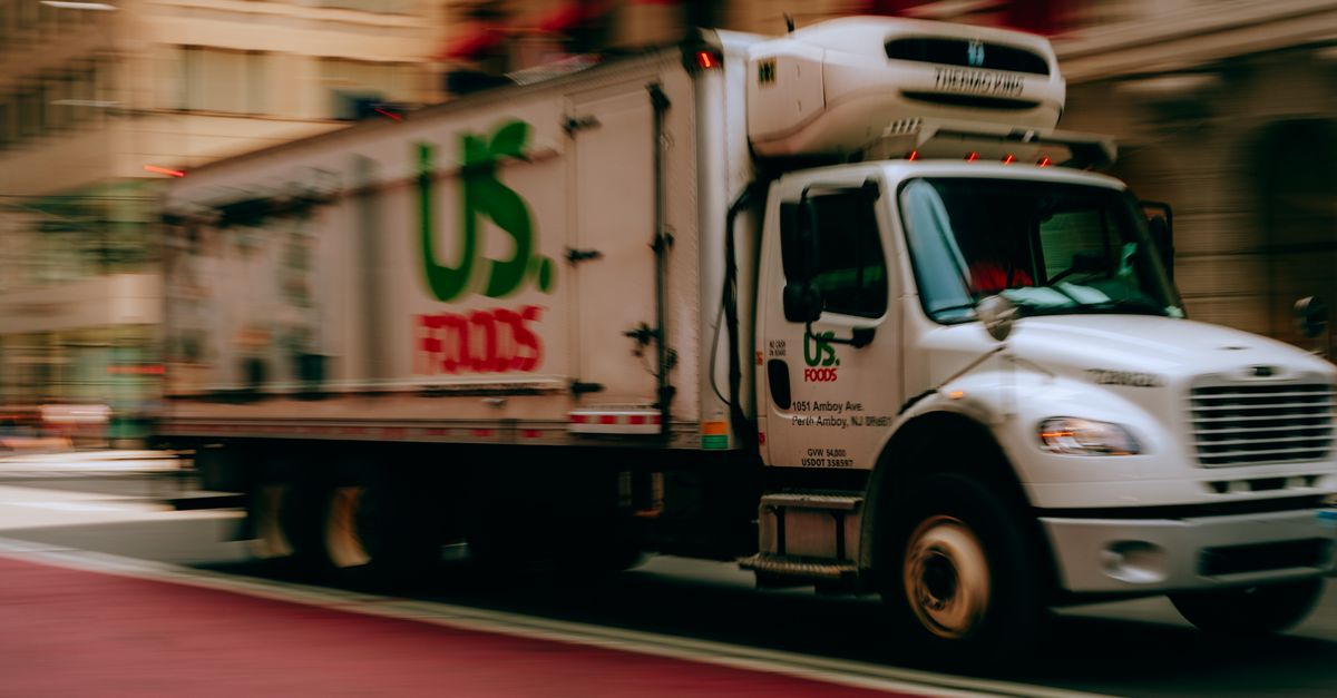 Delivery Hd Urban Delivery Truck Driving Through City Street · Free Stock Photo