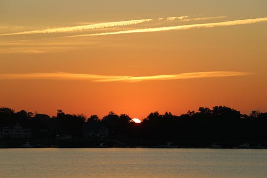 Experience the serene beauty of a sunrise over Cove Island Park in Stamford, CT.