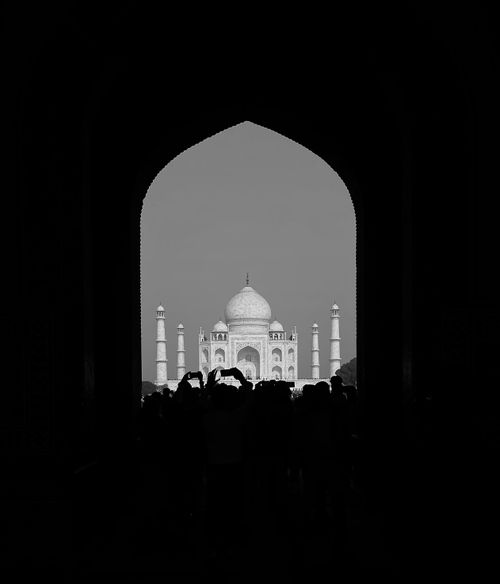 Free A dramatic silhouette framing the iconic Taj Mahal in Agra, India. Stock Photo