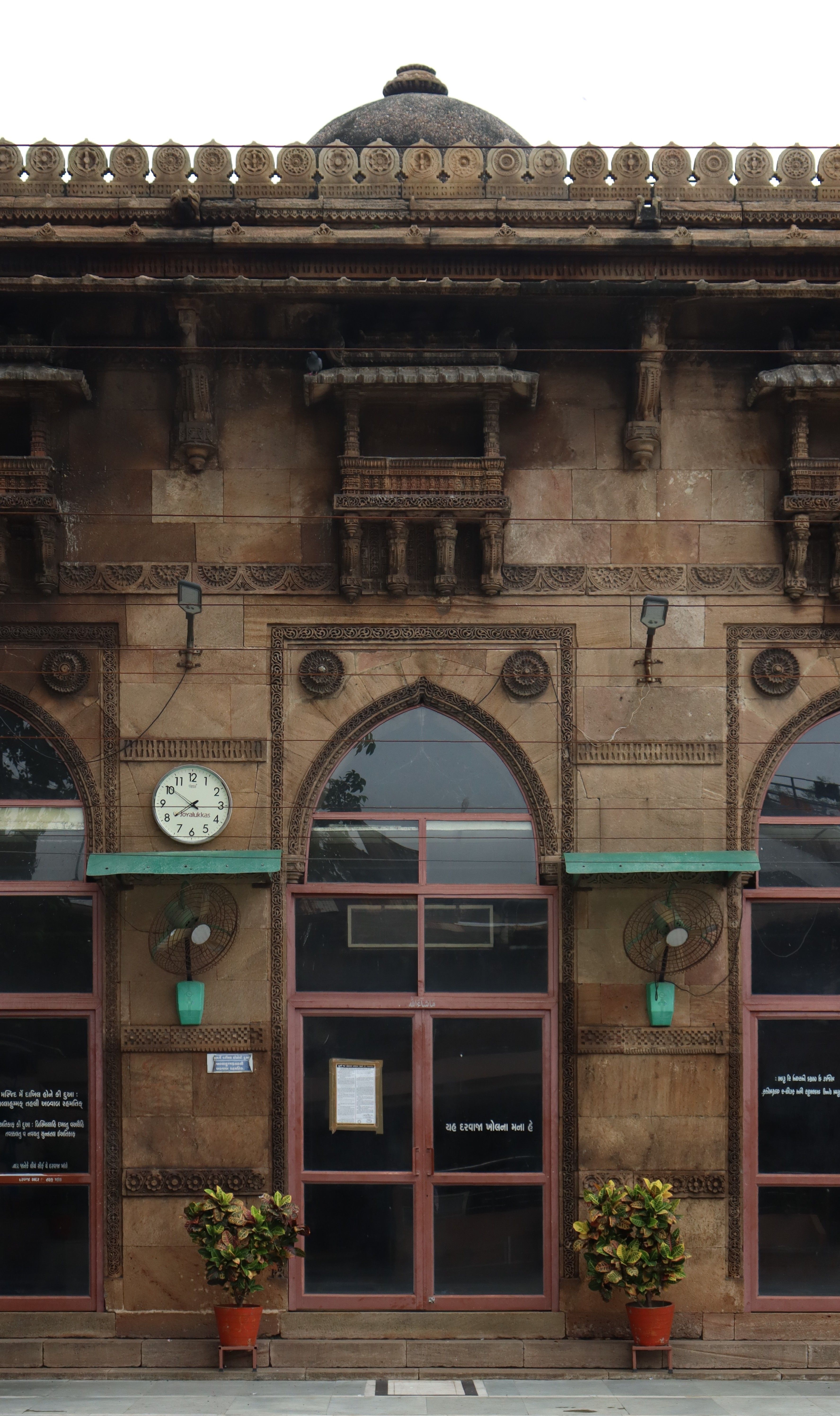 Historic Indian Building Facade with Arched Windows · Free Stock Photo
