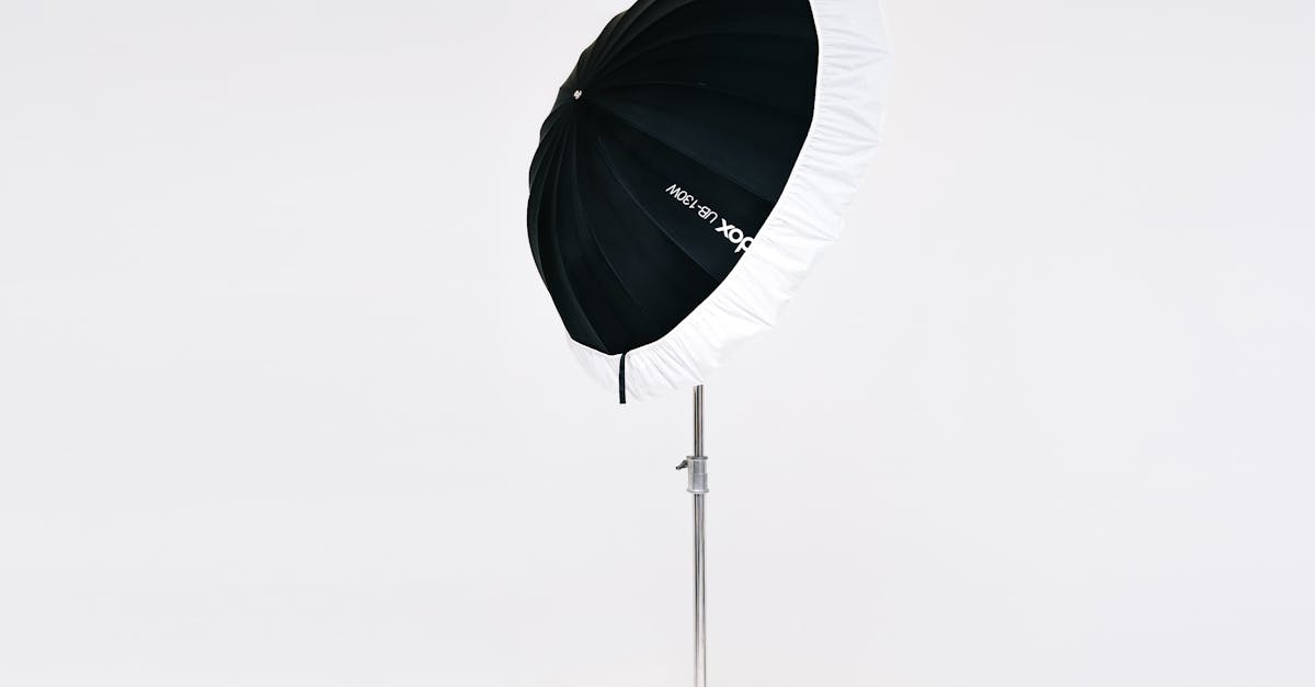 Studio light umbrella on a stand for professional photography setup.