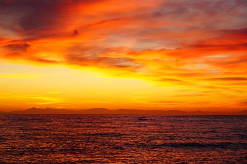 Free Stunning sunset over the Aegean Sea with vivid orange skies near Athens, Greece. Stock Photo