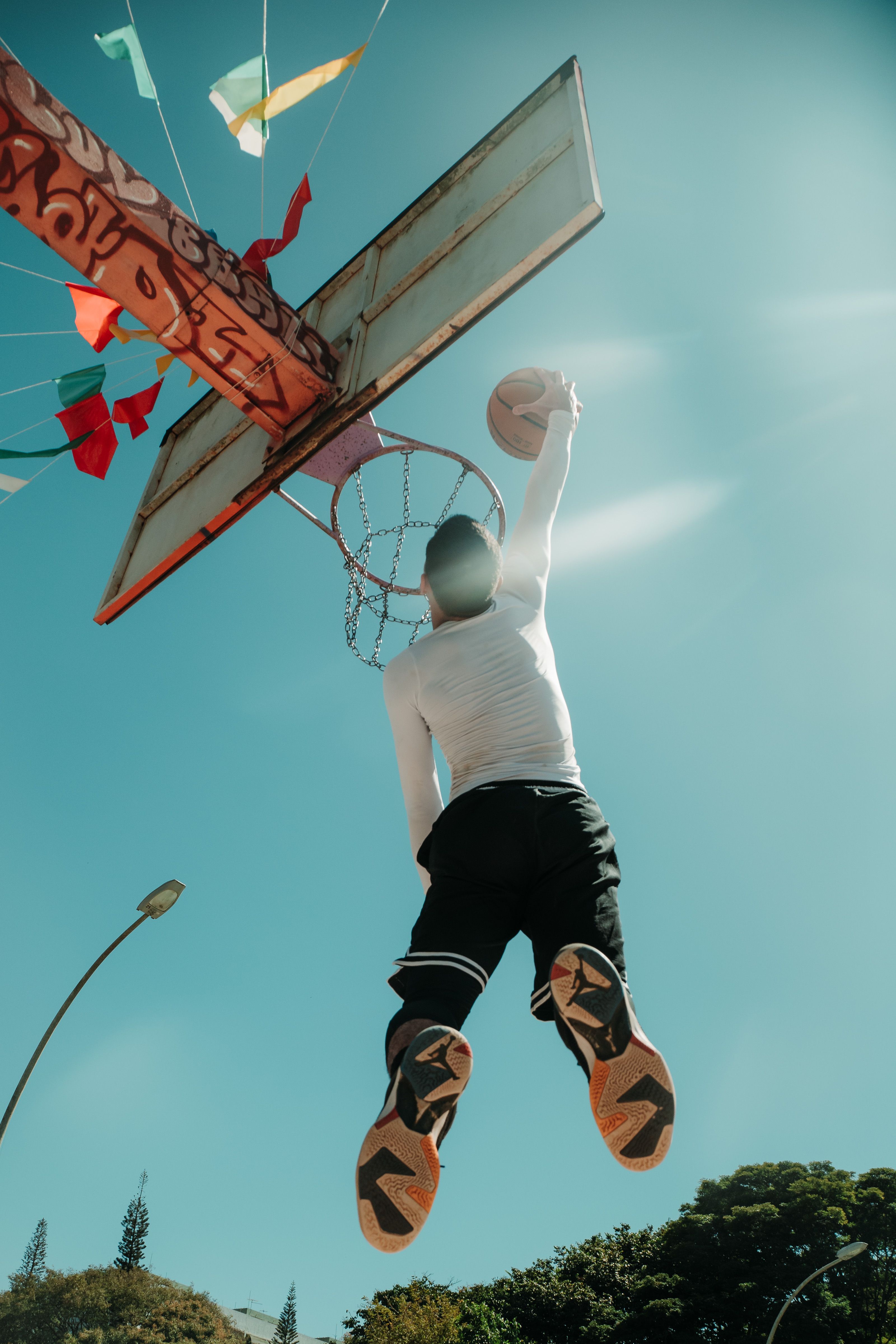 Dynamic Basketball Dunk in Brasília Sky · Free Stock Photo