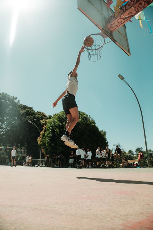 Free Dynamic action shot of a basketball player dunking outdoors in Brasília, Brasil. Stock Photo
