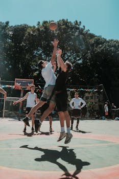 Exciting street basketball game in Brasília on a sunny day.