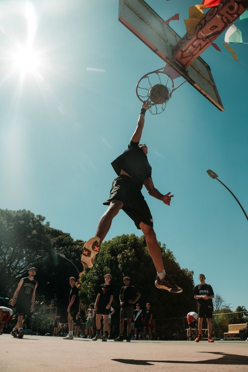 Free An exciting moment of a basketball player dunking outdoors in Brasília, Brazil. Stock Photo