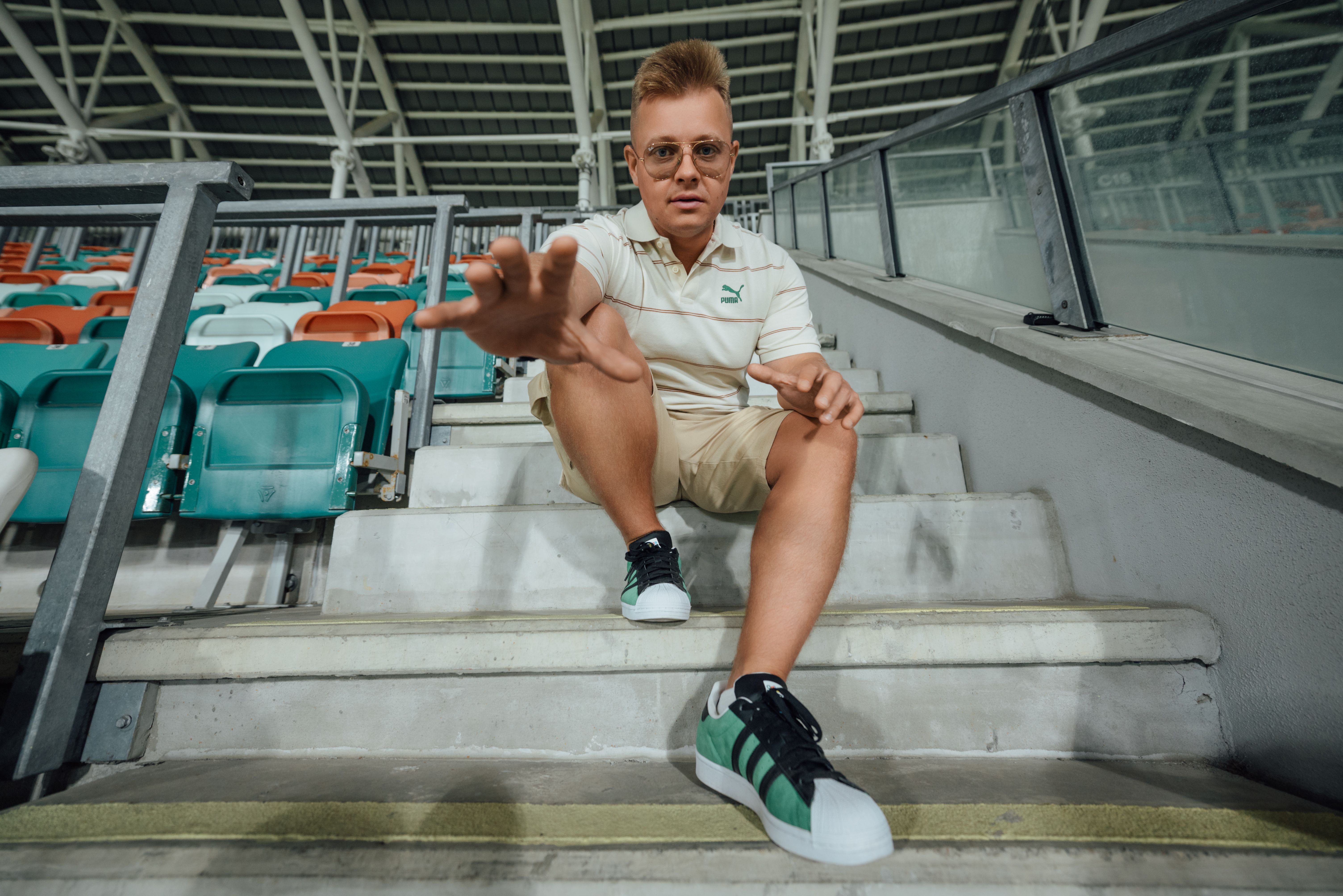Casual Urban Style in Modern Stadium Seating · Free Stock Photo