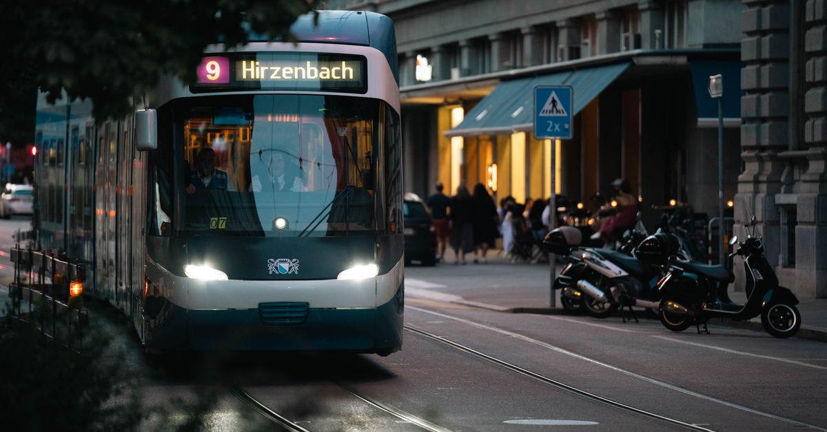 City tram at twilight on an urban street, capturing evening hustle and transport dynamics.