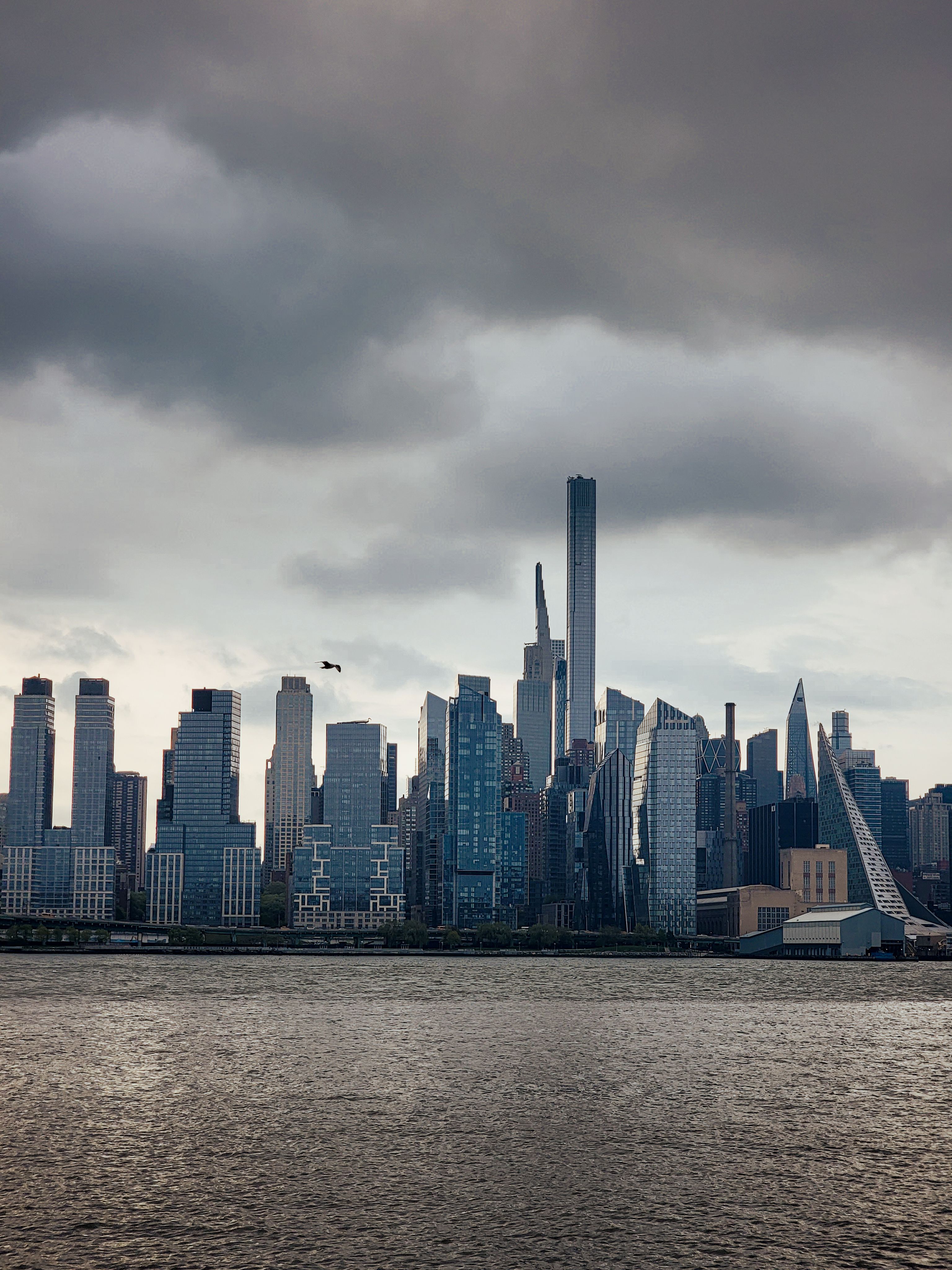 Stunning New York City skyline under cloudy sky · Free Stock Photo