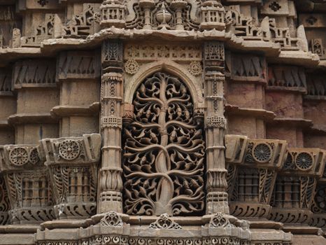 Close-up of detailed stone carving on a historic architectural structure.