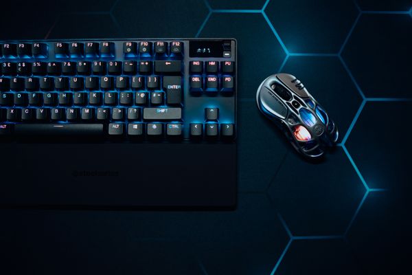 RGB gaming keyboard and mouse on hexagon pattern