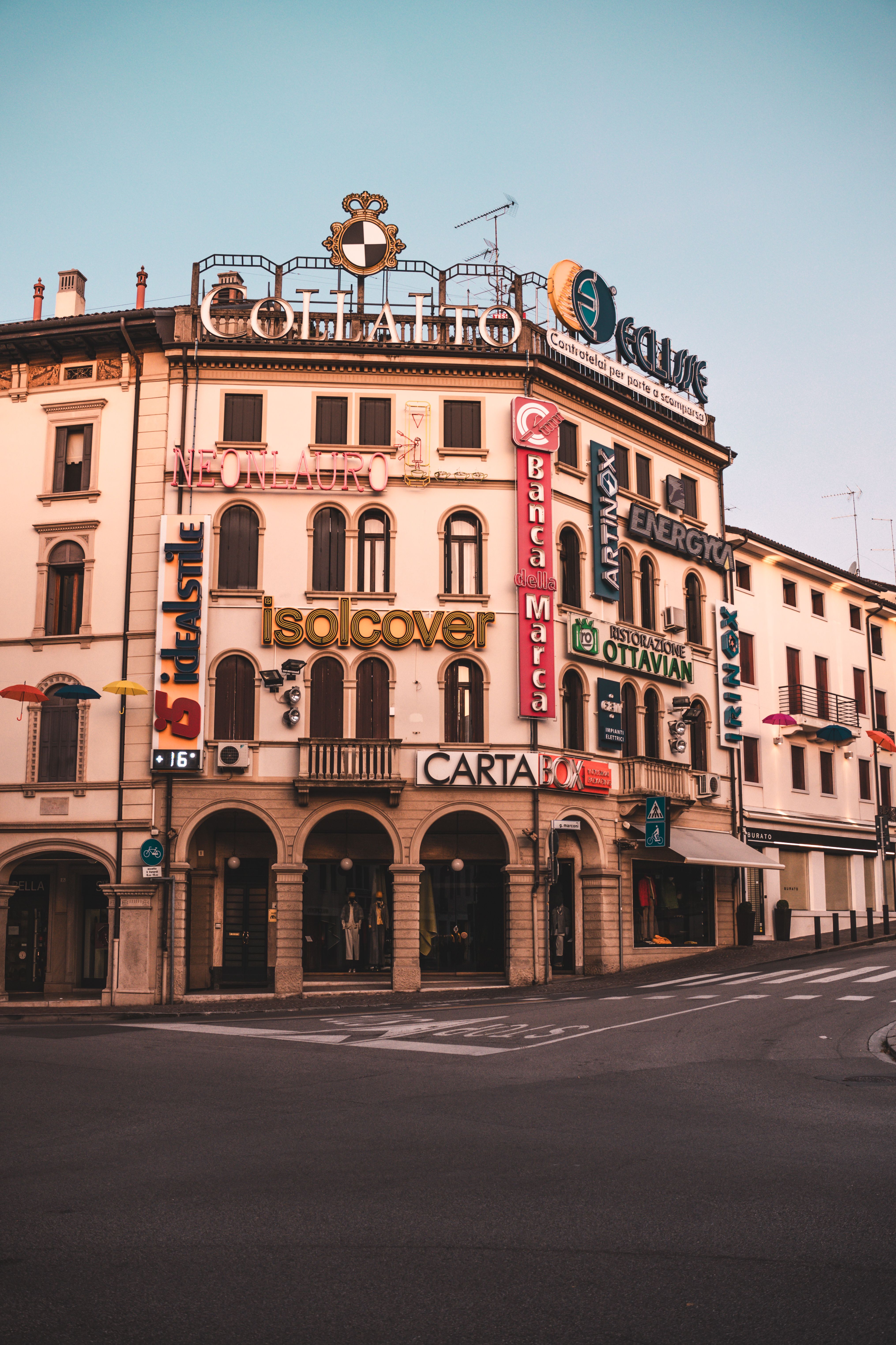 Historic European Building with Colorful Signage · Free Stock Photo