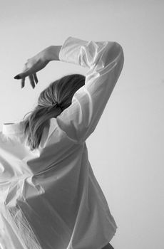 Black and white artistic portrait capturing an elegant dance pose.