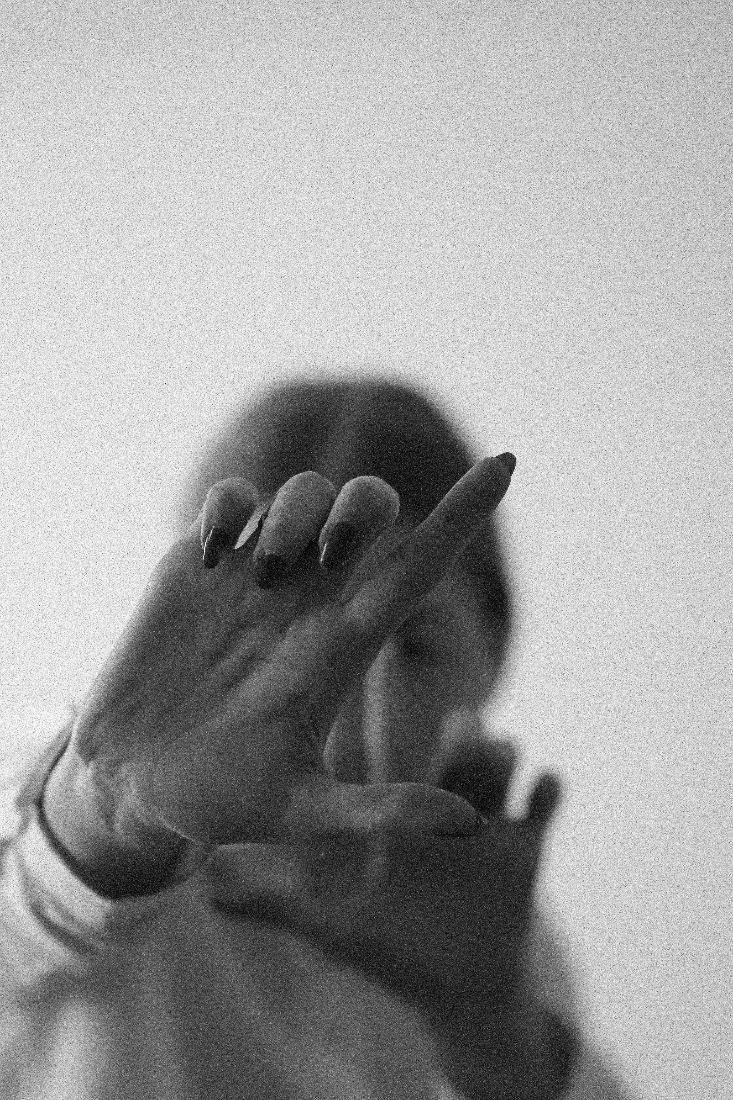 Artistic Black and White Hand Gesture Portrait · Free Stock Photo