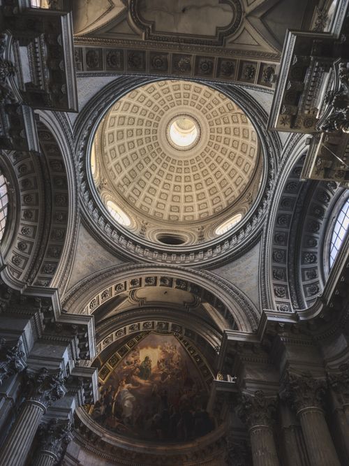 Free Intricate view of a Renaissance cathedral dome, featuring ornate architecture and soft lighting. Stock Photo