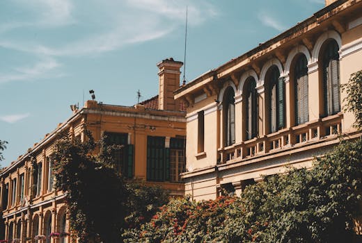 Charming colonial architecture in Hanoi's Old Quarter, showcasing vivid autumn colors.